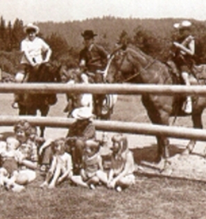 Old photo of campers and horses