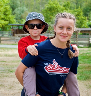 Camper getting a piggyback ride