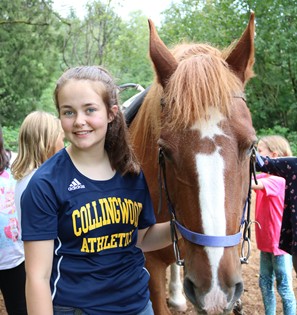 Summer staff member with horse